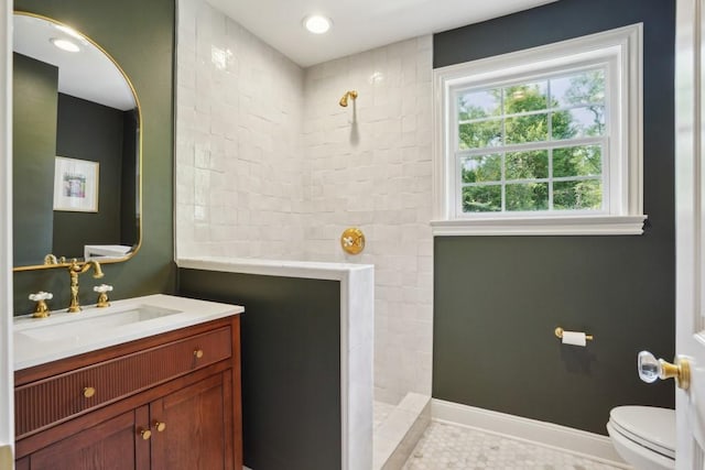 42 Riverdale Dr, Covington, LA 70433 - bathroom with a walk in shower, toilet, vanity, and baseboards