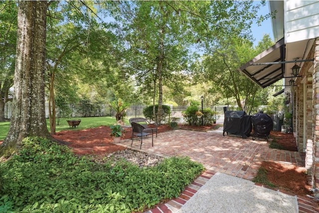 42 Riverdale Dr, Covington, LA 70433 - fenced backyard featuring a patio area