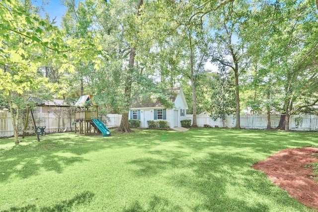 42 Riverdale Dr, Covington, LA 70433 - view of yard featuring a playground and an outdoor structure