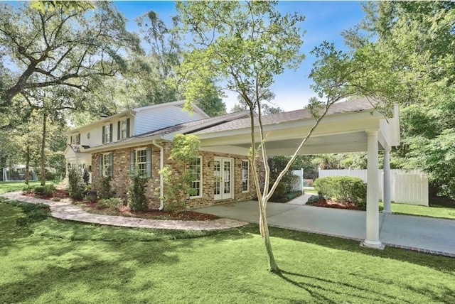 42 Riverdale Dr, Covington, LA 70433 - rear view of house featuring brick siding and french doors