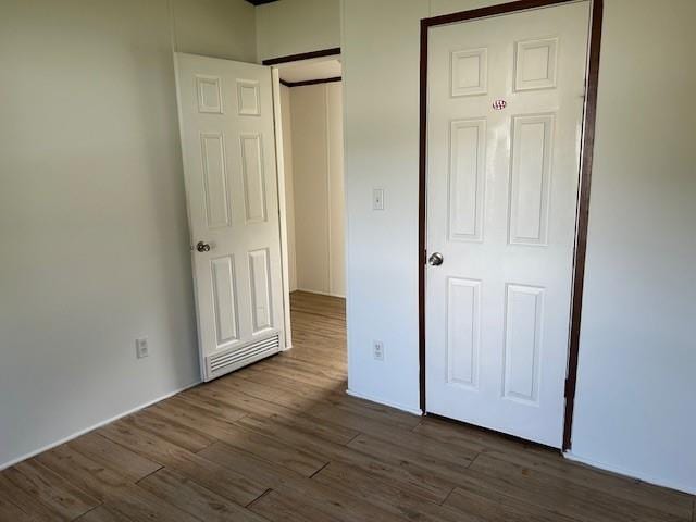 26214 E Sycamore St, Lacombe, LA 70445 - unfurnished bedroom with dark wood-style floors