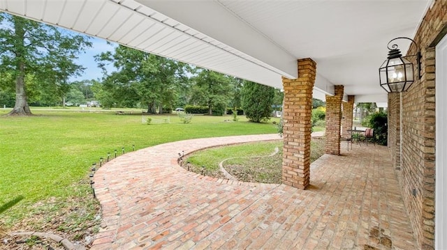 61258 N Military Rd, Slidell, LA 70461 - view of patio featuring view of wooded area