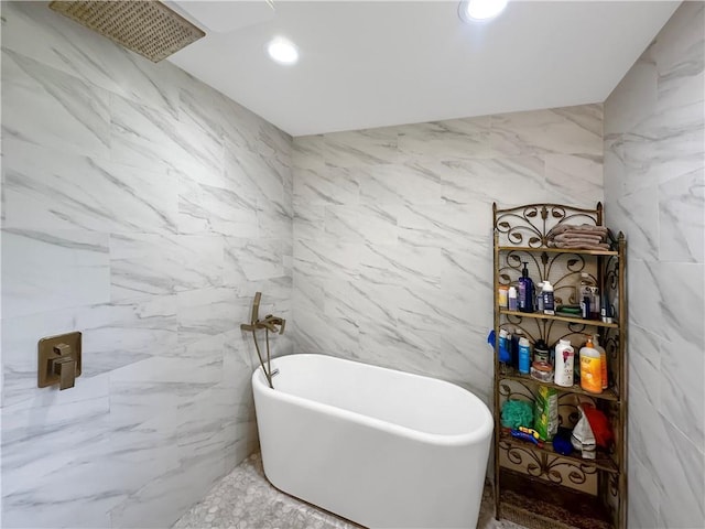 61258 N Military Rd, Slidell, LA 70461 - bathroom with tile walls, a soaking tub, and recessed lighting