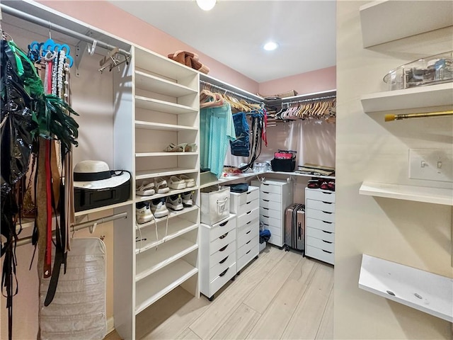 61258 N Military Rd, Slidell, LA 70461 - walk in closet with light wood-type flooring
