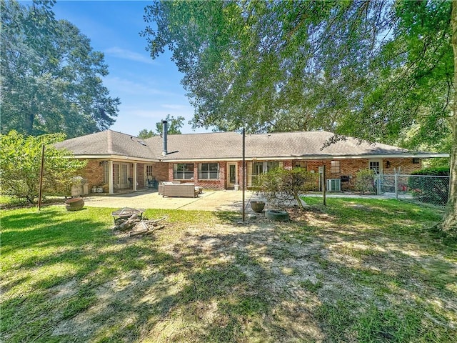 61258 N Military Rd, Slidell, LA 70461 - back of property featuring a patio, an outdoor living space, and brick siding