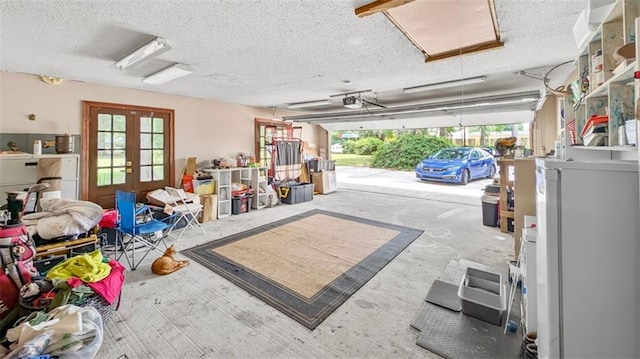 61258 N Military Rd, Slidell, LA 70461 - garage with french doors, refrigerator, and a garage door opener