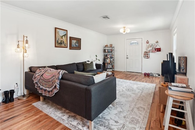 1101 Fairway Dr, Kenner, LA 70062 - living room featuring light wood-style floors and crown molding