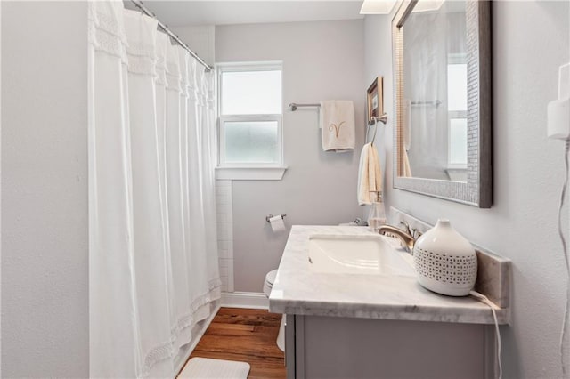 1101 Fairway Dr, Kenner, LA 70062 - bathroom with vanity, wood finished floors, toilet, and curtained shower