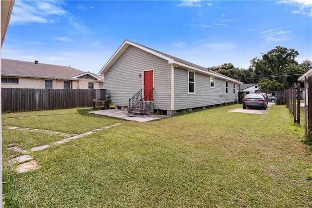 1101 Fairway Dr, Kenner, LA 70062 - back of house featuring entry steps and central AC