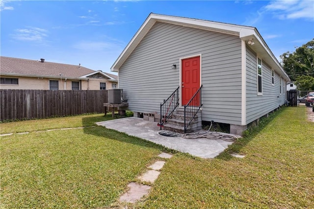 1101 Fairway Dr, Kenner, LA 70062 - back of property with entry steps, a patio area, and central AC unit