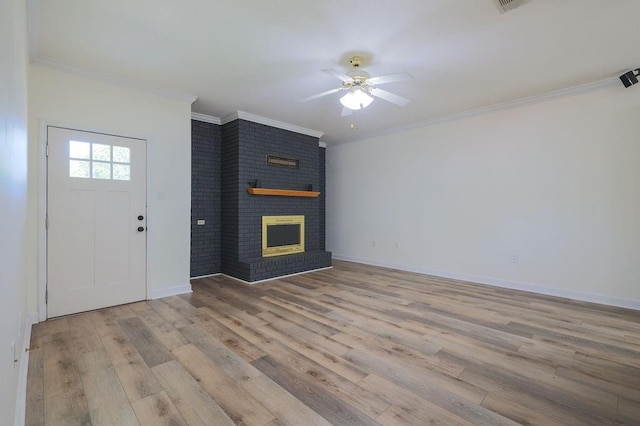 1113 Rose Meadow Loop, Slidell, LA 70460 - entrance foyer featuring wood finished floors, a ceiling fan, crown molding, a brick fireplace, and baseboards