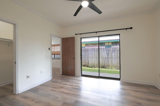 1113 Rose Meadow Loop, Slidell, LA 70460 - unfurnished bedroom featuring crown molding, access to outside, wood finished floors, baseboards, and a closet
