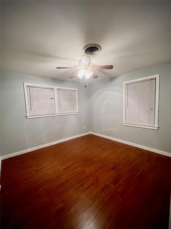 2228 Kentucky Ave, Kenner, LA 70062 - unfurnished room featuring ceiling fan, wood finished floors, and baseboards