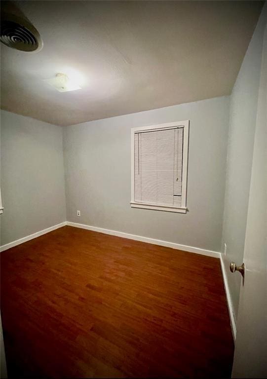2228 Kentucky Ave, Kenner, LA 70062 - spare room featuring wood finished floors and baseboards