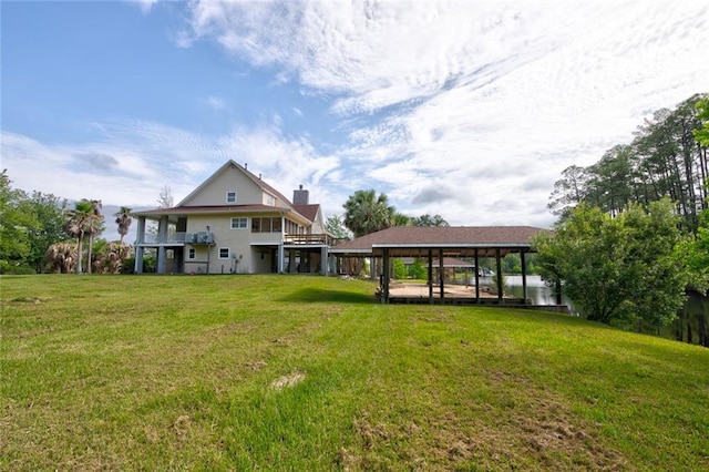 59394 E Harbor Ln, Lacombe, LA 70445 - back of property with a yard and a chimney