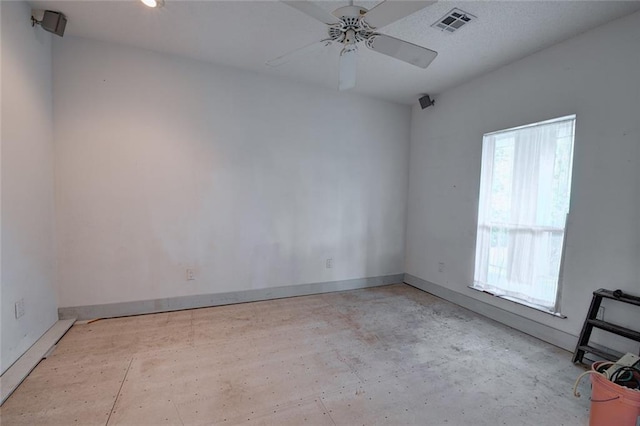 59394 E Harbor Ln, Lacombe, LA 70445 - unfurnished room with ceiling fan, baseboards, and concrete floors