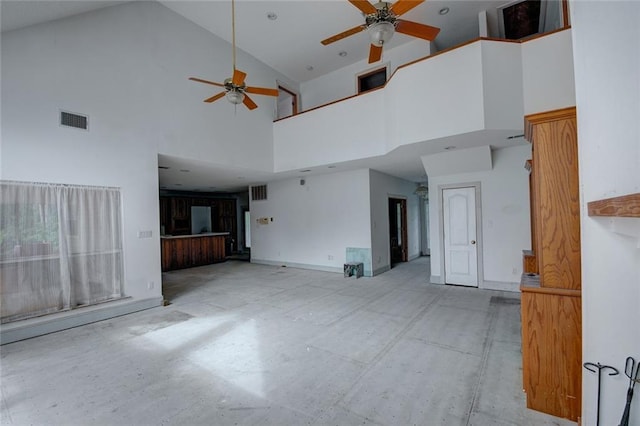 59394 E Harbor Ln, Lacombe, LA 70445 - unfurnished living room featuring ceiling fan, high vaulted ceiling, and baseboards