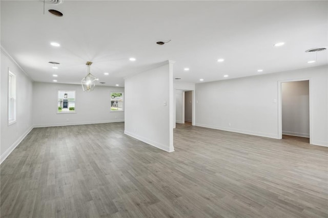 3313 Clifford Dr, Metairie, LA 70002 - unfurnished living room with baseboards, wood finished floors, and recessed lighting