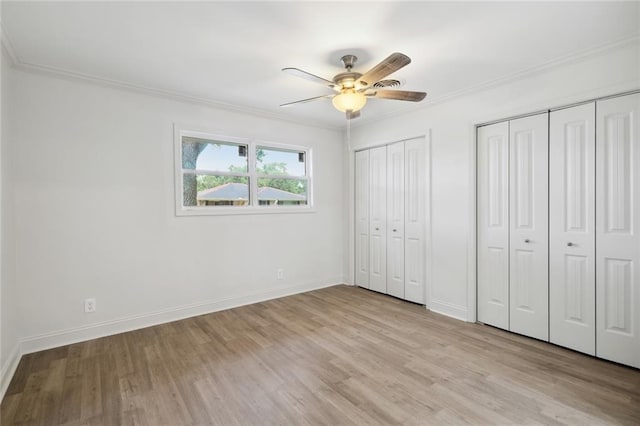 3313 Clifford Dr, Metairie, LA 70002 - unfurnished bedroom with light wood-type flooring, ornamental molding, two closets, and baseboards