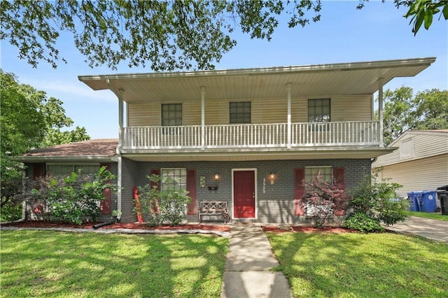 2529 Hudson Pl, New Orleans, LA 70131 - front of property with a balcony, a front yard, brick siding, and a porch