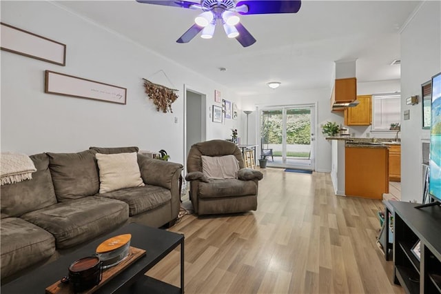 2529 Hudson Pl, New Orleans, LA 70131 - living area with ceiling fan and light wood-style flooring