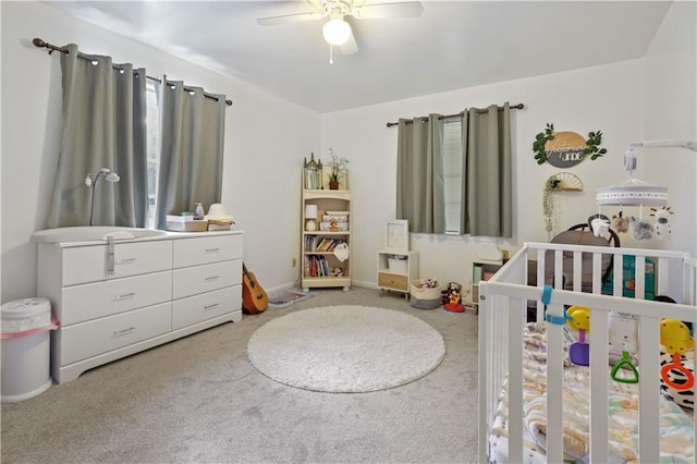2529 Hudson Pl, New Orleans, LA 70131 - bedroom with a crib, carpet flooring, and ceiling fan