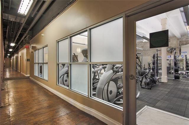 920 Poeyfarre St Unit 264, New Orleans, LA 70130 - hallway featuring wood finished floors and baseboards