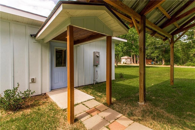 51075 Jenkins Ln, Tickfaw, LA 70466 - property entrance with board and batten siding and a yard