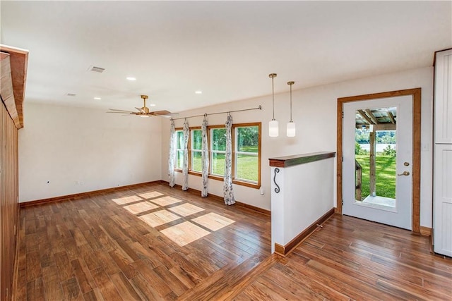 51075 Jenkins Ln, Tickfaw, LA 70466 - unfurnished dining area with healthy amount of natural light, baseboards, wood finished floors, and recessed lighting