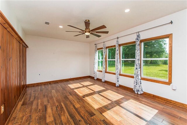 51075 Jenkins Ln, Tickfaw, LA 70466 - unfurnished room with baseboards, wood finished floors, a ceiling fan, and recessed lighting