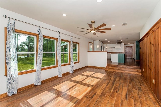 51075 Jenkins Ln, Tickfaw, LA 70466 - unfurnished living room with plenty of natural light, wood finished floors, ceiling fan, recessed lighting, and baseboards