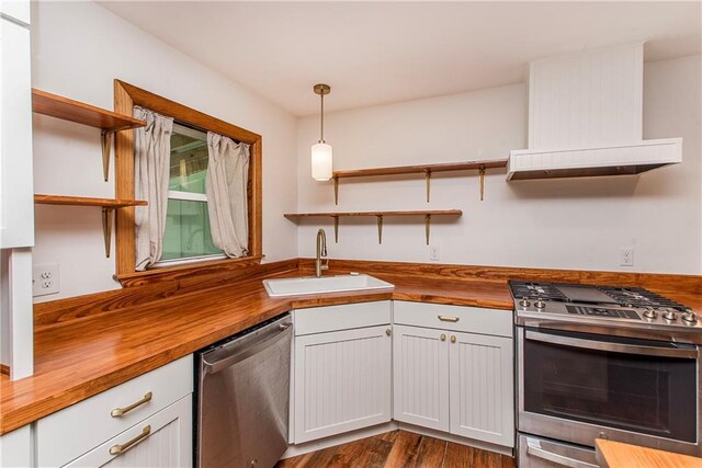 51075 Jenkins Ln, Tickfaw, LA 70466 - kitchen featuring wooden counters, open shelves, stainless steel appliances, and a sink