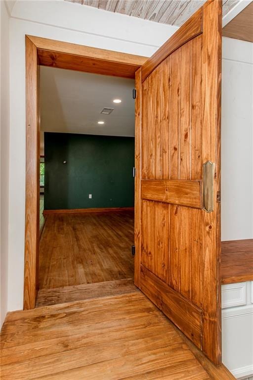 51075 Jenkins Ln, Tickfaw, LA 70466 - hallway featuring wood finished floors
