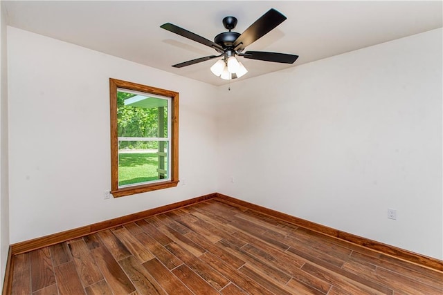 51075 Jenkins Ln, Tickfaw, LA 70466 - empty room with dark wood finished floors, baseboards, and ceiling fan