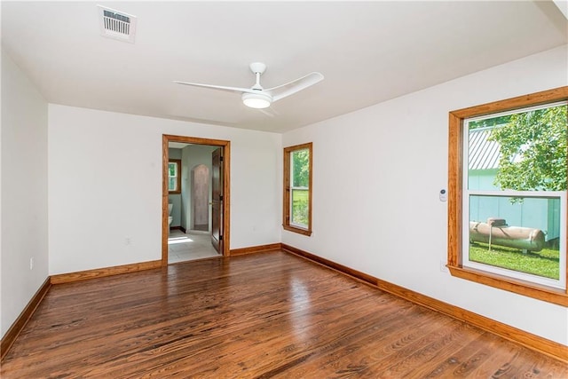 51075 Jenkins Ln, Tickfaw, LA 70466 - spare room featuring plenty of natural light, baseboards, and wood finished floors