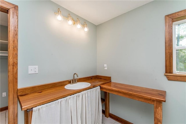 51075 Jenkins Ln, Tickfaw, LA 70466 - bathroom featuring a sink and baseboards