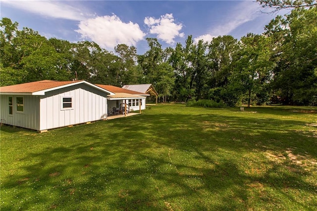 51075 Jenkins Ln, Tickfaw, LA 70466 - view of green lawn with view of wooded area