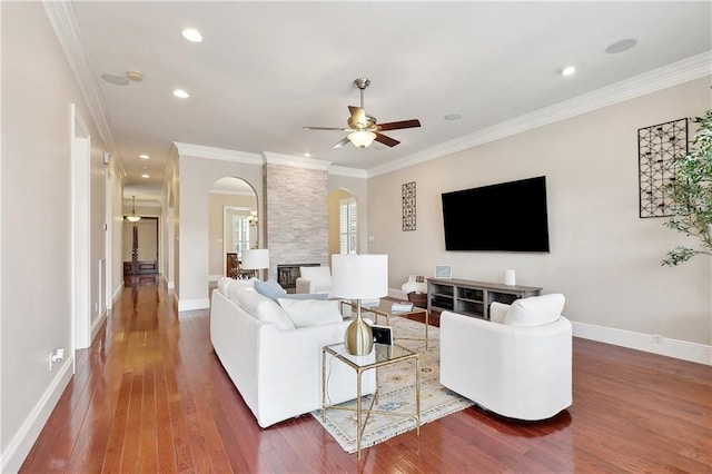 6919 Memphis St, New Orleans, LA 70124 - living room with arched walkways, a ceiling fan, hardwood / wood-style floors, ornamental molding, and recessed lighting