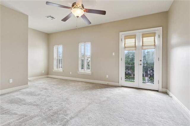 6919 Memphis St, New Orleans, LA 70124 - carpeted empty room with french doors, ceiling fan, and baseboards