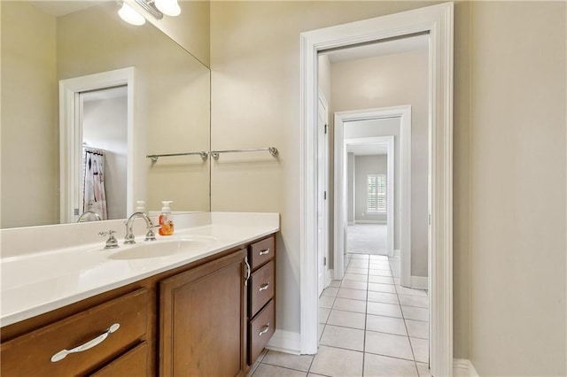 6919 Memphis St, New Orleans, LA 70124 - full bathroom featuring tile patterned flooring, vanity, and baseboards