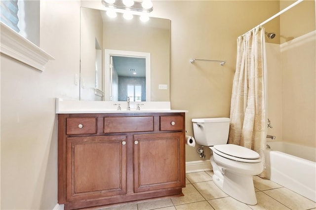 6919 Memphis St, New Orleans, LA 70124 - bathroom featuring toilet, tile patterned floors, vanity, shower / bath combo, and baseboards