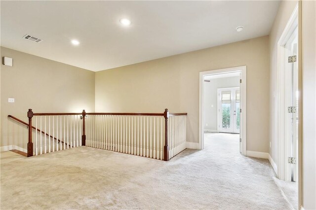 6919 Memphis St, New Orleans, LA 70124 - hallway featuring light colored carpet, an upstairs landing, baseboards, and recessed lighting