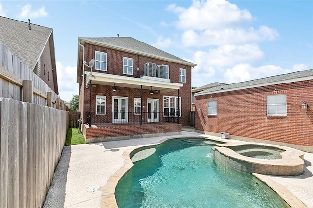 6919 Memphis St, New Orleans, LA 70124 - back of property with brick siding, a patio area, a fenced backyard, and french doors