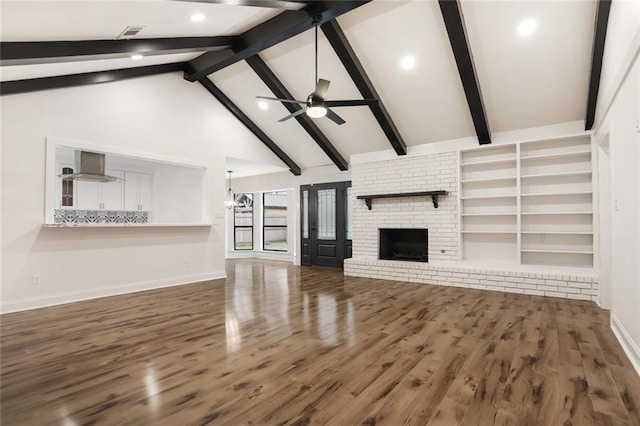 25 Woodvine Ct, Covington, LA 70433 - unfurnished living room featuring a ceiling fan, baseboards, wood finished floors, a brick fireplace, and recessed lighting