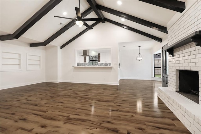 25 Woodvine Ct, Covington, LA 70433 - unfurnished living room with beam ceiling, dark wood finished floors, recessed lighting, baseboards, and a brick fireplace