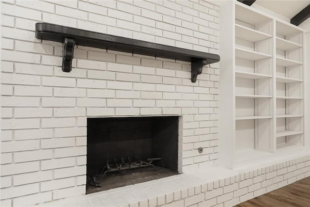 25 Woodvine Ct, Covington, LA 70433 - detailed view of a brick fireplace and wood finished floors