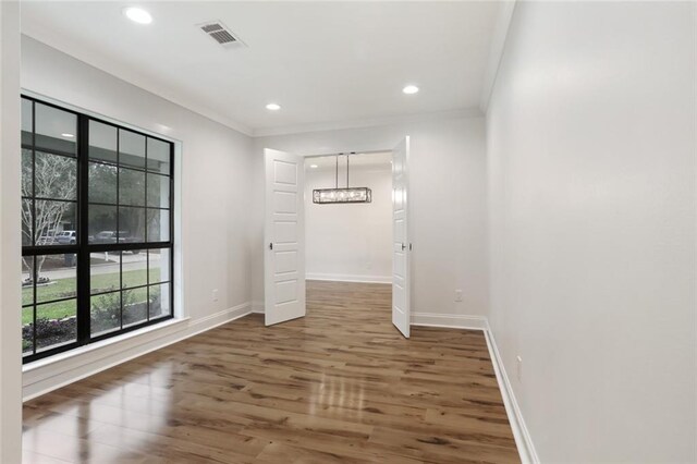 25 Woodvine Ct, Covington, LA 70433 - unfurnished room featuring a chandelier, wood finished floors, ornamental molding, baseboards, and recessed lighting