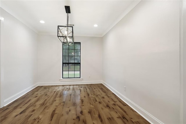 25 Woodvine Ct, Covington, LA 70433 - spare room featuring a chandelier, baseboards, wood finished floors, crown molding, and recessed lighting