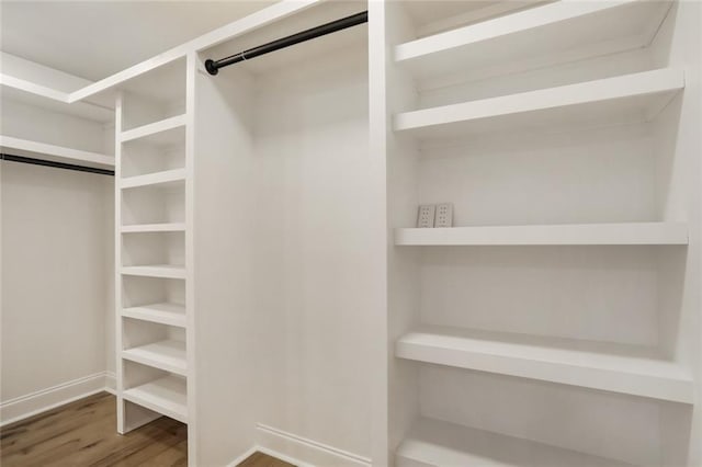 25 Woodvine Ct, Covington, LA 70433 - walk in closet featuring wood finished floors