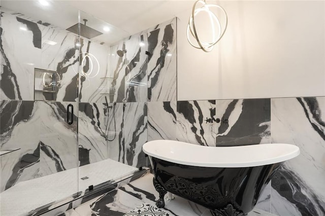 25 Woodvine Ct, Covington, LA 70433 - bathroom featuring a marble finish shower, a freestanding bath, tile walls, and recessed lighting